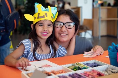 A local family attends a community event hosted by United Way's Success By 6 Coalition.